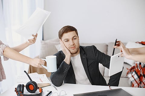 a professional experiencing burnout and being overwhelmed by tasks