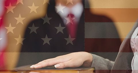 a person taking an oath on a book