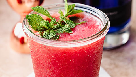 Strawberry mint frose made with Empress 1908 Indigo Gin garnished with mint