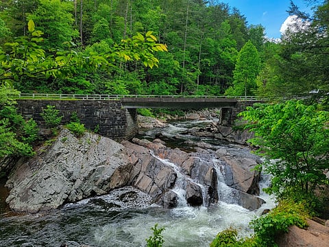 a scenic roadside waterfall