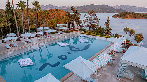 Dior-designed pool at D Maris Bay overlooking the Aegean coastline and private coves