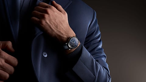 Model wearing a Frederique Constant Manufacture watch with blue dial