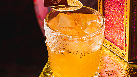 Moroccan Margarita cocktail with spiced rim and citrus garnish