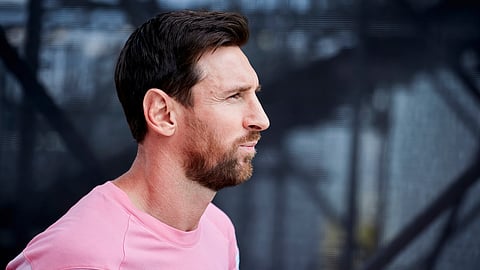 Lionel Messi in a pink training top before a football session