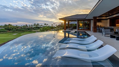 Infinity pool at Kaunaoa 22 overlooking Hawaii's Kohala Coast at sunset