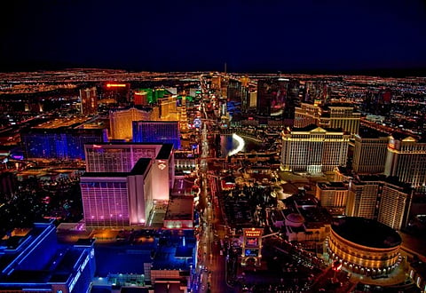 Aerial night view of Las Vegas skyline with illuminated hotels and city lights