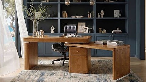 Modern wood home office with built-in shelving and a multifunctional executive desk