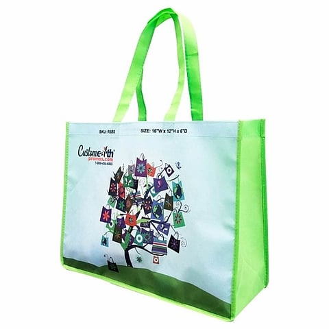 Green shopping bag featuring a tree graphic, symbolizing eco-friendliness and sustainability.