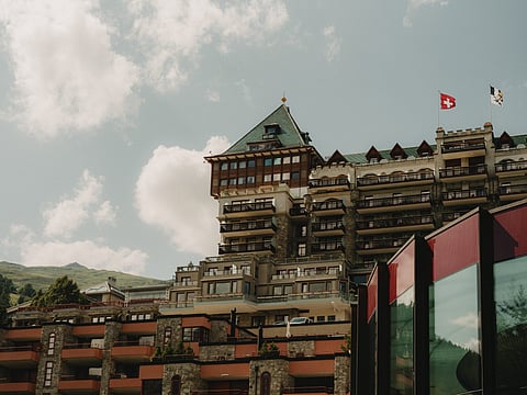 Exterior tower of Badrutt's Palace Hotel rising above St. Moritz