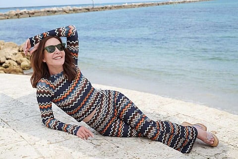Actress and Watskin founder Lois Robbins wearing a Watskin design