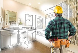 Contractor viewing bathroom remodel.