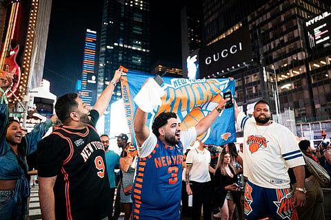 New York Knicks fans celebrating in Times Square.