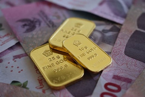 Gold bars on banknotes.