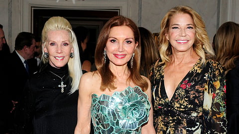 Three women in evening attire at the French Heritage Society reception in New York