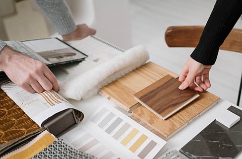 People reviewing interior design samples.