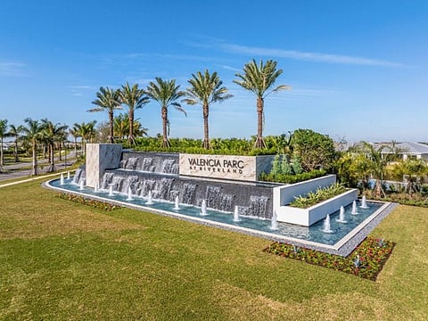 Valencia Parc at Riverland entrance sign with waterfall