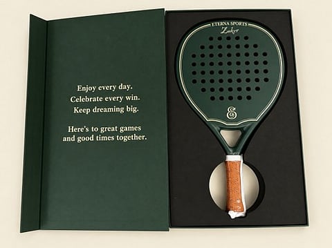Personalized padel gifts, an engraved carbon padel racket in a green gift box