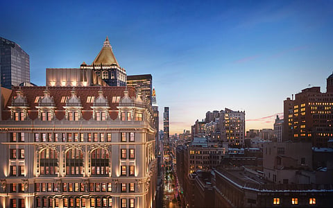 Rendering of the illuminated terra-cotta crown of 95 Madison at dusk above Madison Avenue
