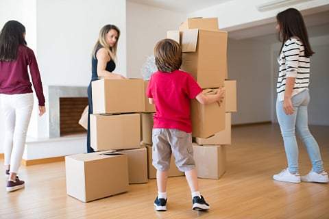 Family with moving boxes.