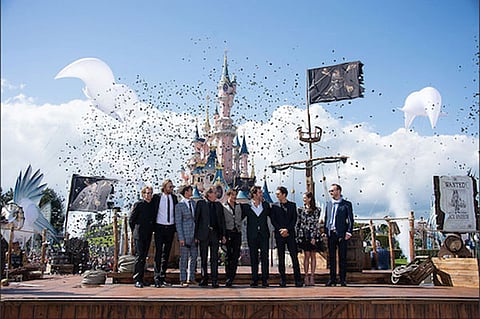 the cast of Pirates of the Caribbean: Dead Men Tell No Tales in front of the castle
