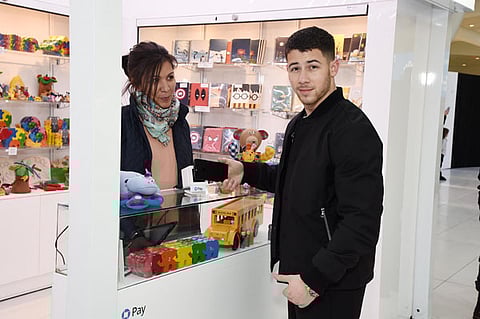 '- New York, NY - 12/13/2017 - Nick Jonas stops by the Chase Pay Village in NYC to do some holiday shopping and surprise shoppers with a pop-up performance.