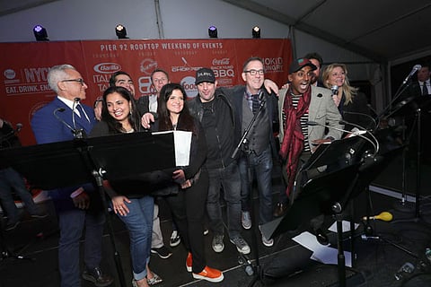 NEW YORK, NY - OCTOBER 15: (L-R) Chopped judges Chef's Geoffrey Zakarian, Maneet Chauhan, Alex Guarnaschelli, Chris Santos, host Ted Allen, Marcus Samuelsson and Amanda Freitag speak onstage at Rooftop "Chopped" during the Food Network & Cooking Channel New York City Wine & Food Festival presented by Coca-Cola at Pier 92 on October 15, 2016 in New York City. (Photo by Cindy Ord/Getty Images for NYCWFF)