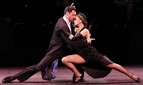 NEW YORK, NY - JULY 11:   Dancers/TV personalities Maksim Chmerkovskiy and Karina Smirnoff perform at the 'Forever Tango' Press Preview at Walter Kerr Theatre on July 11, 2013 in New York City.
