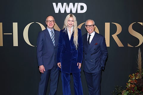 NEW YORK, NEW YORK - OCTOBER 25: (L-R) James Fallon, Gigi Hadid, and Tommy Hilfiger attend the 2022 WWD Honors at Cipriani South Street on October 25, 2022 in New York City. (Photo by Dimitrios Kambouris/WWD via Getty Images)