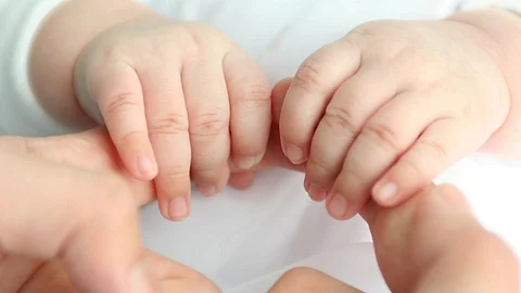 Baby With 4 Legs And 4 Hands