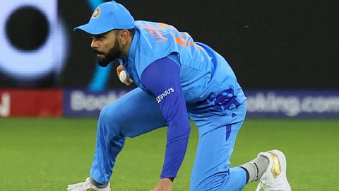 Virat Kohli fielding on ground