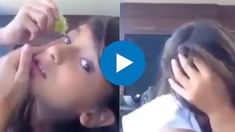 Girl Squeeze Lemon In Eye