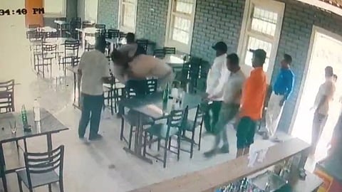 kolhapur police hits hotel owner video viral