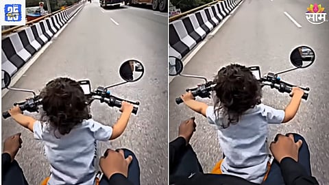 Little boy Riding A Bike On The Road