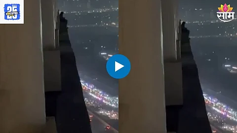 Man Sitting On The Balcony Of A Tall Building