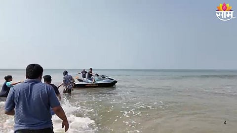 Locals and rescue teams at Guhagar beach in Ratnagiri after a drowning incident involving a family from Mumbai.