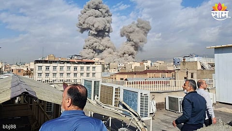 Smoke rises over Tehran following reported airstrikes amid escalating tensions between Iran, the United States, and Israel.