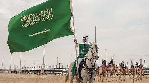 جانب من مسيرة الاحتفاء بيوم العلم