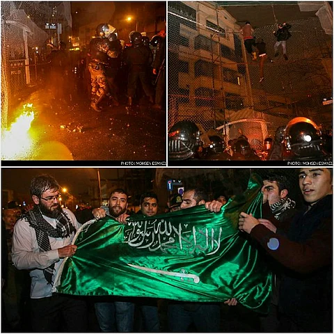 بالصور.. محاولات لإحراق القنصلية السعودية في مشهد الإيرانية