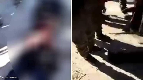 مشاركون في الهجوم التركي على عفرين يمثلون بجثة امرأة كردية