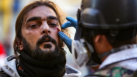 مقتل متظاهر وإصابة 12 آخرين في إطلاق نار على محتجين ببغداد