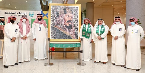 مطار المؤسس بجدة يحتفي باليوم الوطني بعرض للعلم السعودي بأكبر حوض للأسماك بالعالم