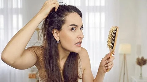 woman combing hair