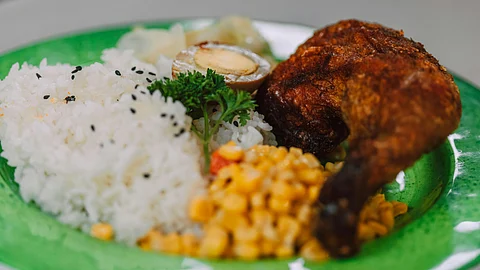 rice and chicken served in a plate