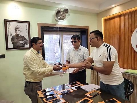 Police returning the mobile to the owner