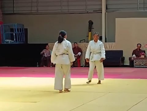 Competitors playing Judo