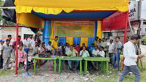 land donor sitting on dharna
