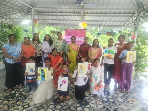 Club members with children holding certificates in their hands
