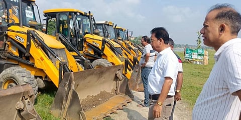 Siliguri Municipal Corporation officials with JCB at Mahananda Ghat