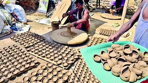 Potter making a diyas