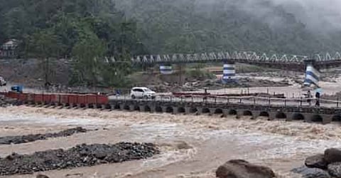 Balasan river flowing in a strong current under the new bridge built in Dudhiya